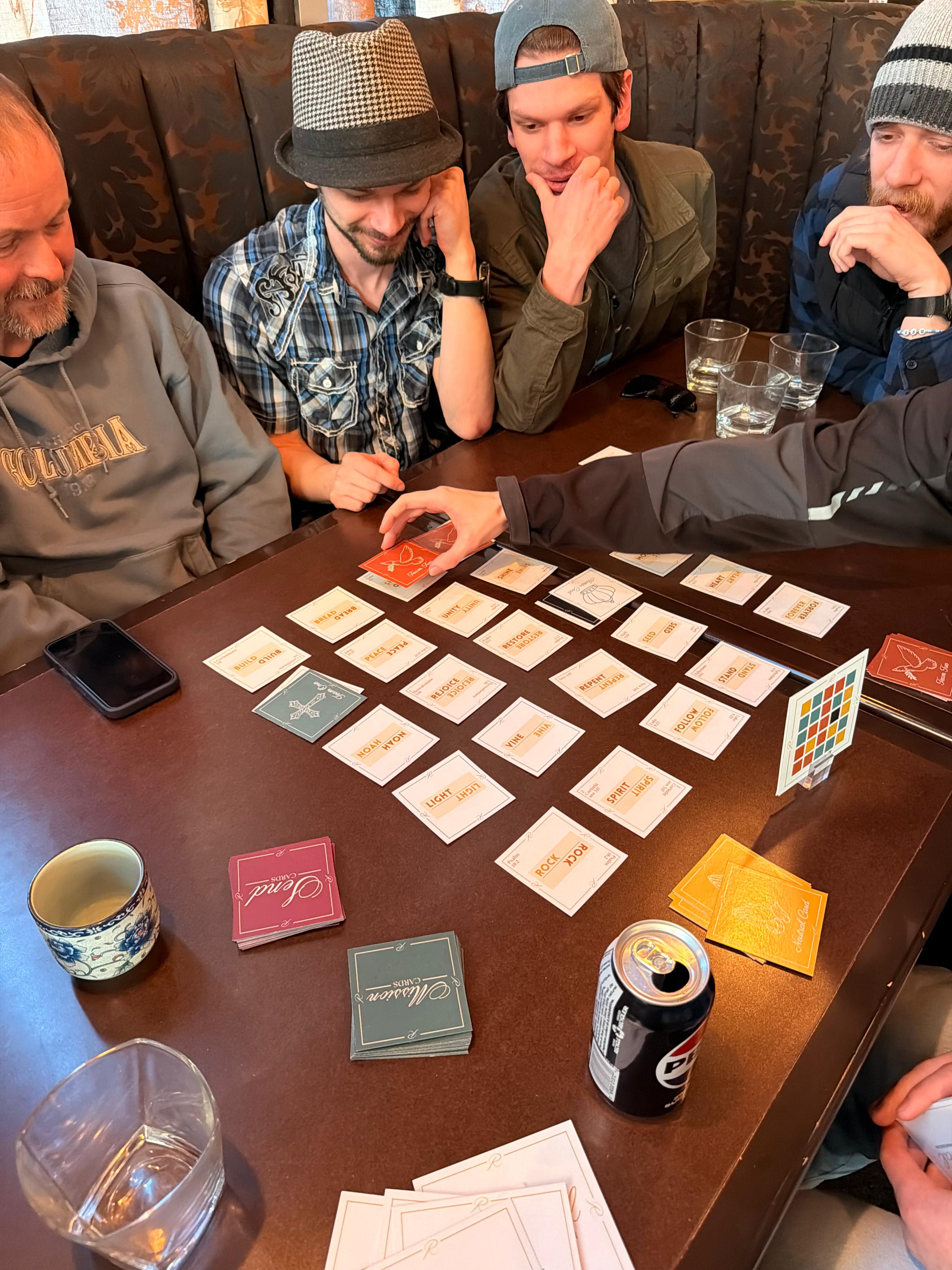 Group of guys playing Revival at a restaurant